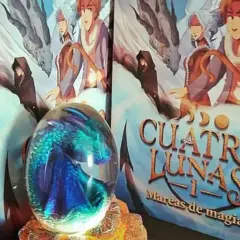 Un huevo de dragón de cristal y libros de "Cuatro Lunas" de Laura Gallego, un ejemplo de literatura fantástica española.