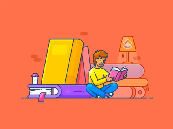 Un joven lee un libro rosa sentado entre grandes libros, buscando inspiración para sus propios libros para empezar a leer adultos.